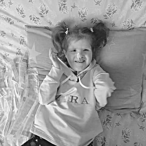 Girl with spinal muscular atrophy in Ukraine.